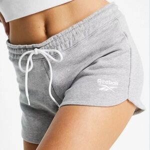 Reebok small logo sweat shorts in gray​​​​​​​​​​​